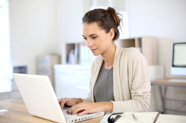 woman is working on laptop