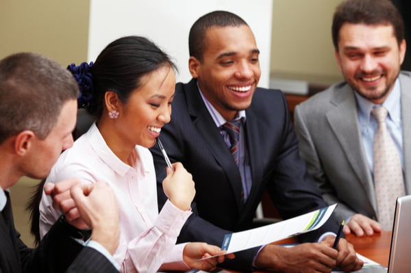 Group of people in a meeting, laughing