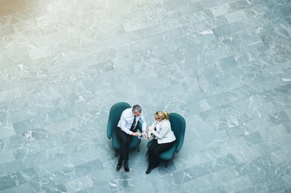 Two people having a meeting out in the open