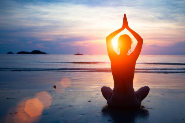 yoga pose on the beach