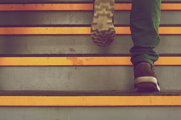 person walking up stairs