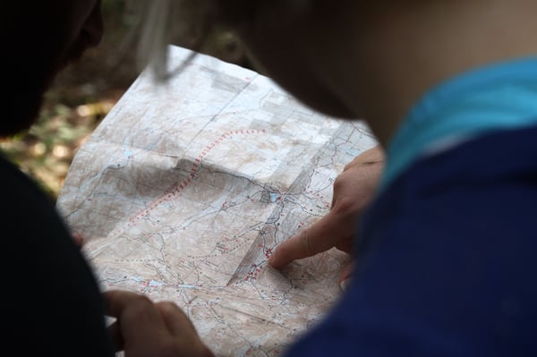 people pointing at a map