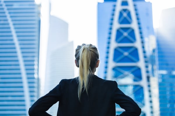 woman is looking at skyscrapers