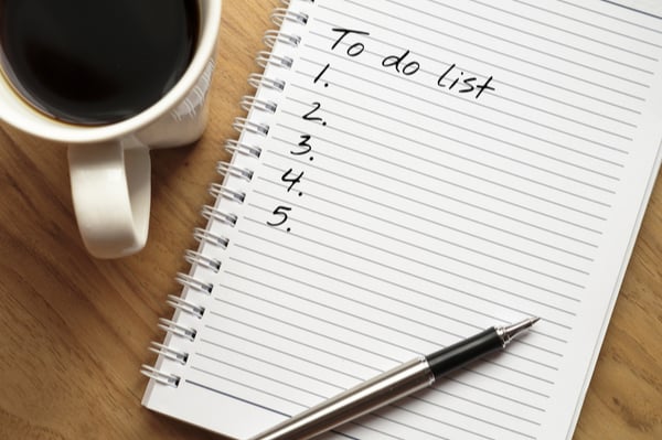 Notepad with to do list written on the first page