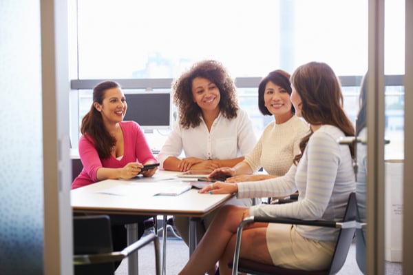 A group of women sitting around a table