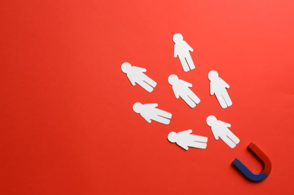 Magnet and paper cut human figures