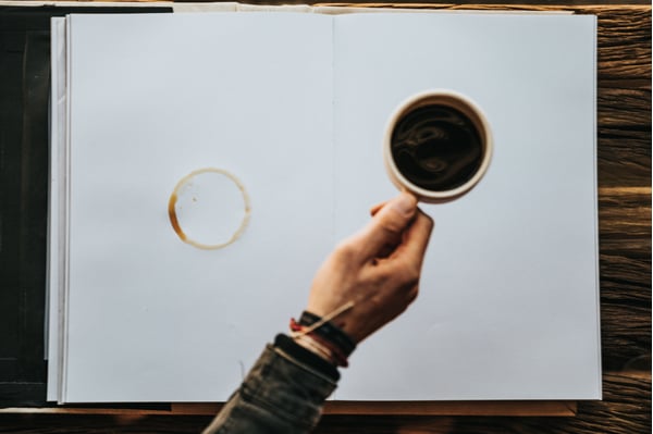 Person holding cup of coffee