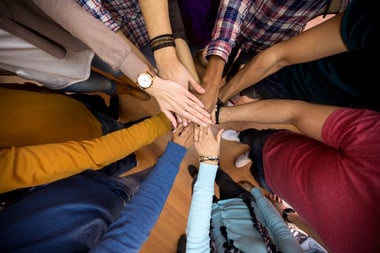 people's hands with different skin colour together