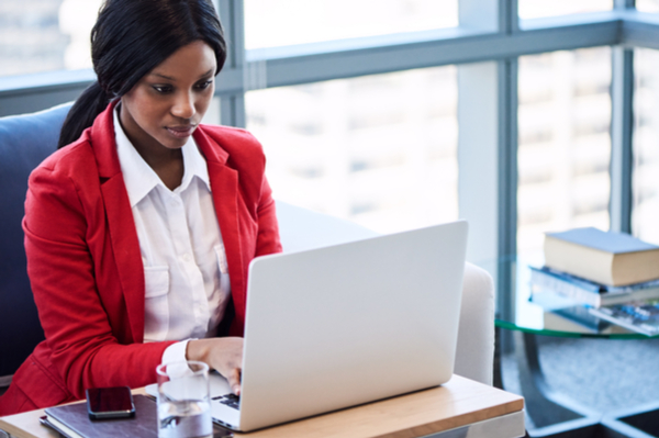 Women at desk typing