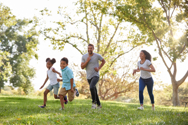 family running across a feild