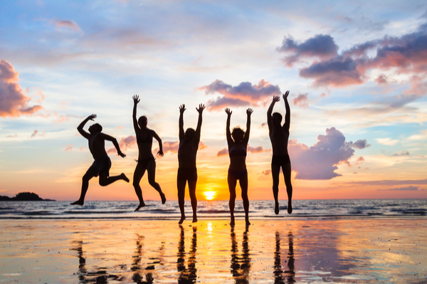 people jumping on the beach