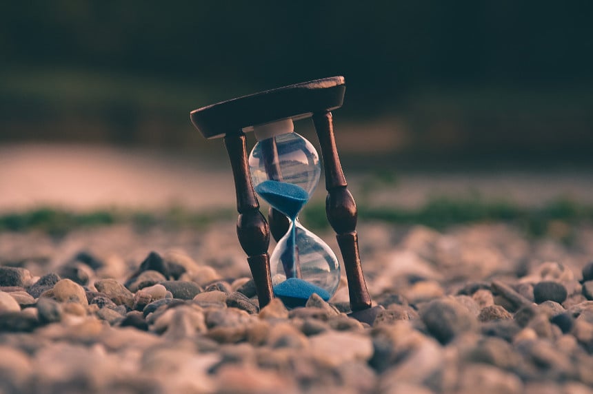 hourglass on rocks