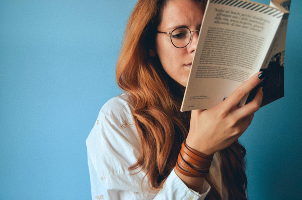 A young woman reading a book