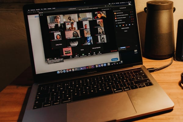 a laptop showing a virtual meeting interface