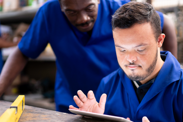 Two men looking at ipad