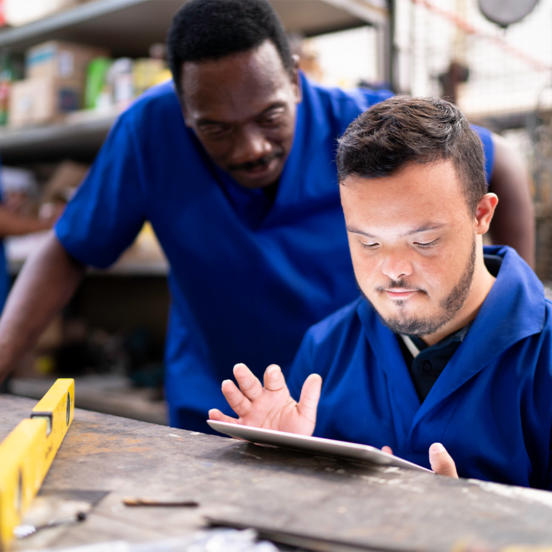 Two men looking at ipad