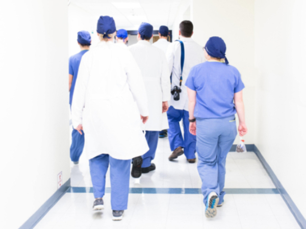 NHS doctors walking down corridor