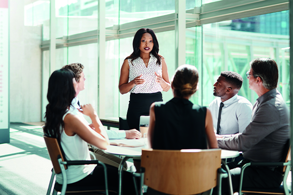 office workers in a meeting around table