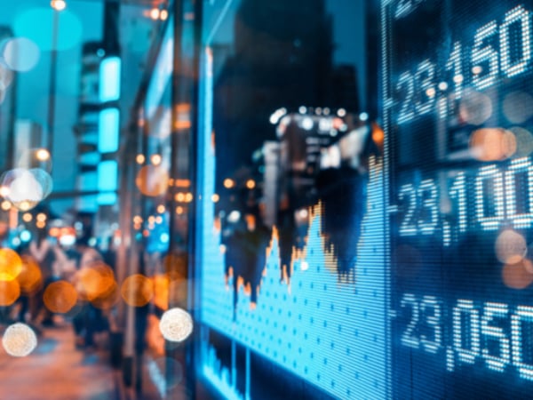 Economic stock market chart reflected in glass window