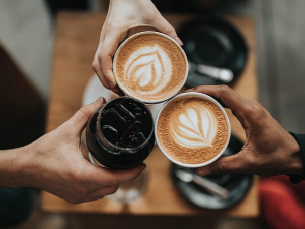 Teams sharing different cups of coffee