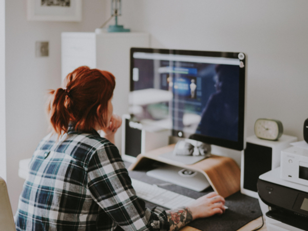 female at Laptop working in office