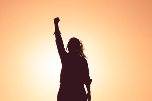 silhouette of person punching air