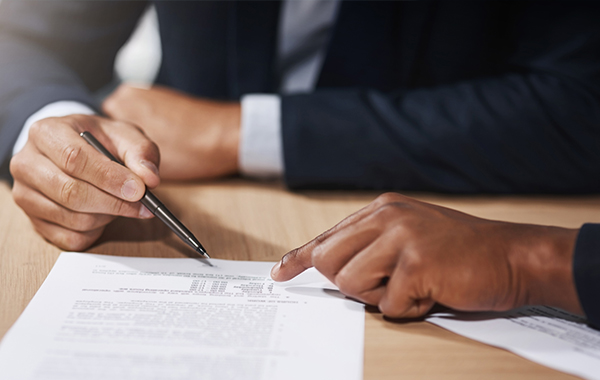 Writing on paper on a desk