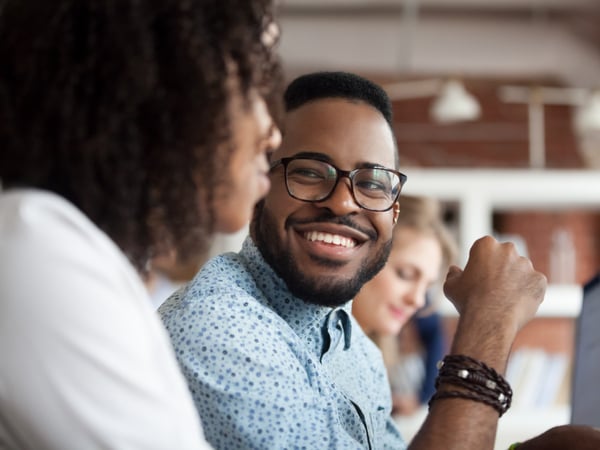 Black colleagues talking at work