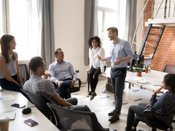 Manager talking to diverse team