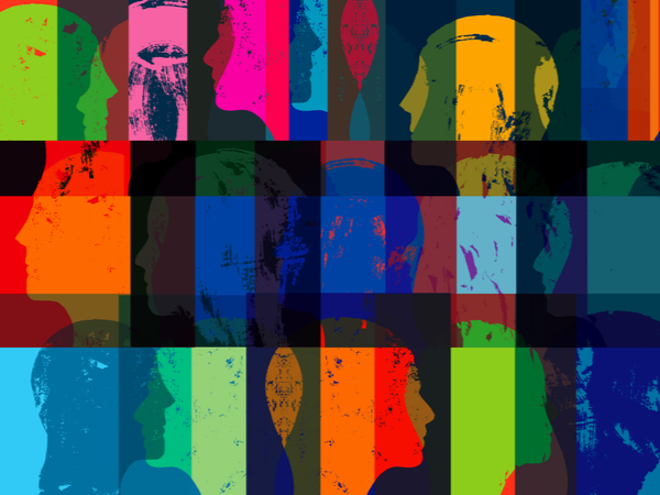Abstract, overlapping silhouettes of faces in many colours