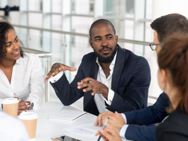 Person using hands to express themselves in a meeting