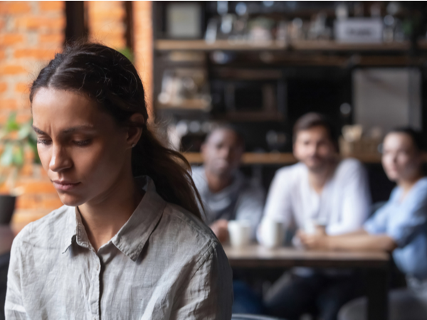 Woman with blurred-out colleagues in background