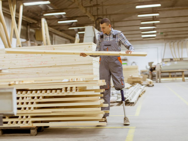 Person with prosthetic leg working in a warehouse