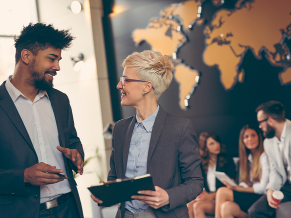 Two people talking at work