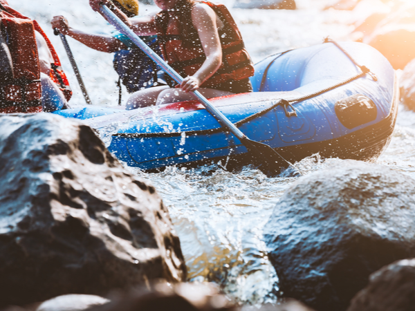 People in a boat, white water rafting