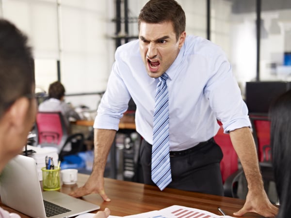 Angry manager shouting at employees