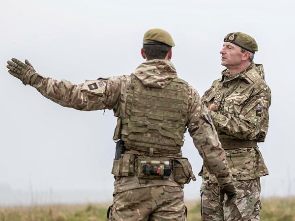 Two Major generals in British Army uniform in deep conversation