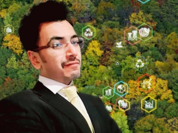 Punit Shah surrounded by trees and symbols of sustainability