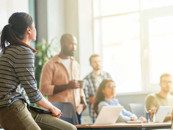 An image of a group of employees working together