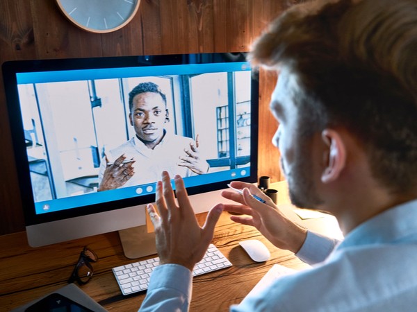 Two colleagues having a remote mentoring session