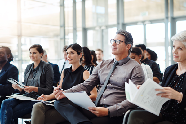 Professionals sitting in a conference