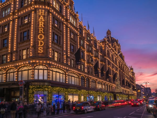 A photograph of the Harrods store in Knightsbridge at sunset