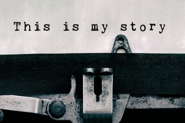 A typewriter writing 'this is my story'