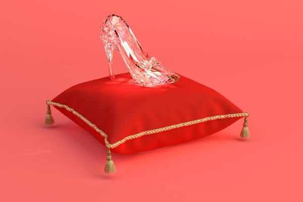 A glass slipper on a pillow