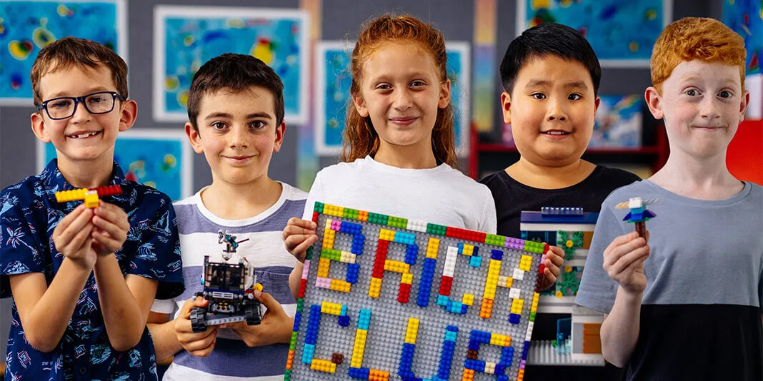 A picture of five children who are part of the LEGO brick club