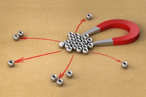A magnet attracting metal balls