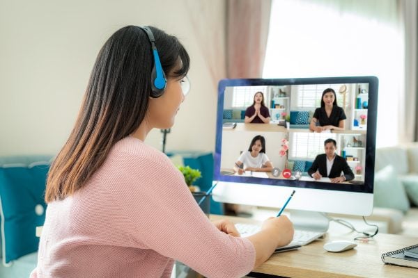 A person having a remote meeting while working from home