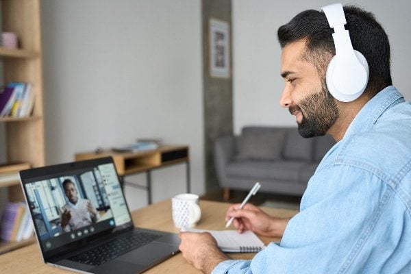 A man in a remote meeting