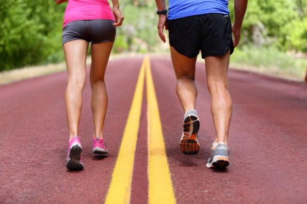 A man and a woman running next to each other