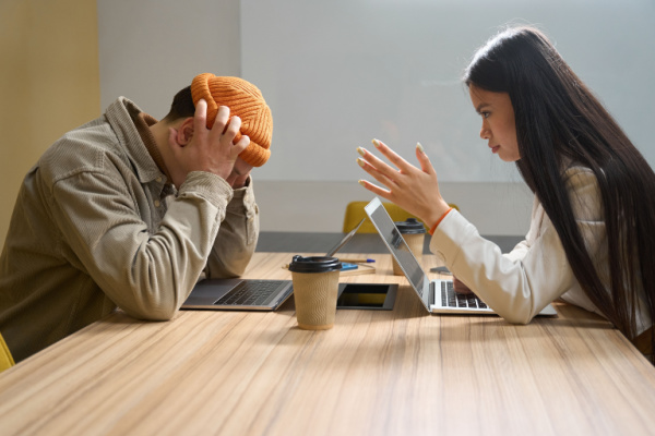 Two frustrated people having a difficult conversation